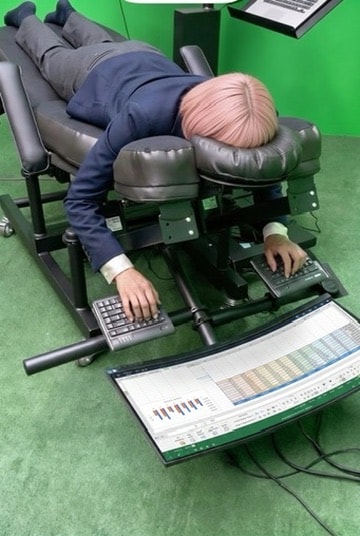 Adjustable ergonomic workstation in a reclined working configuration